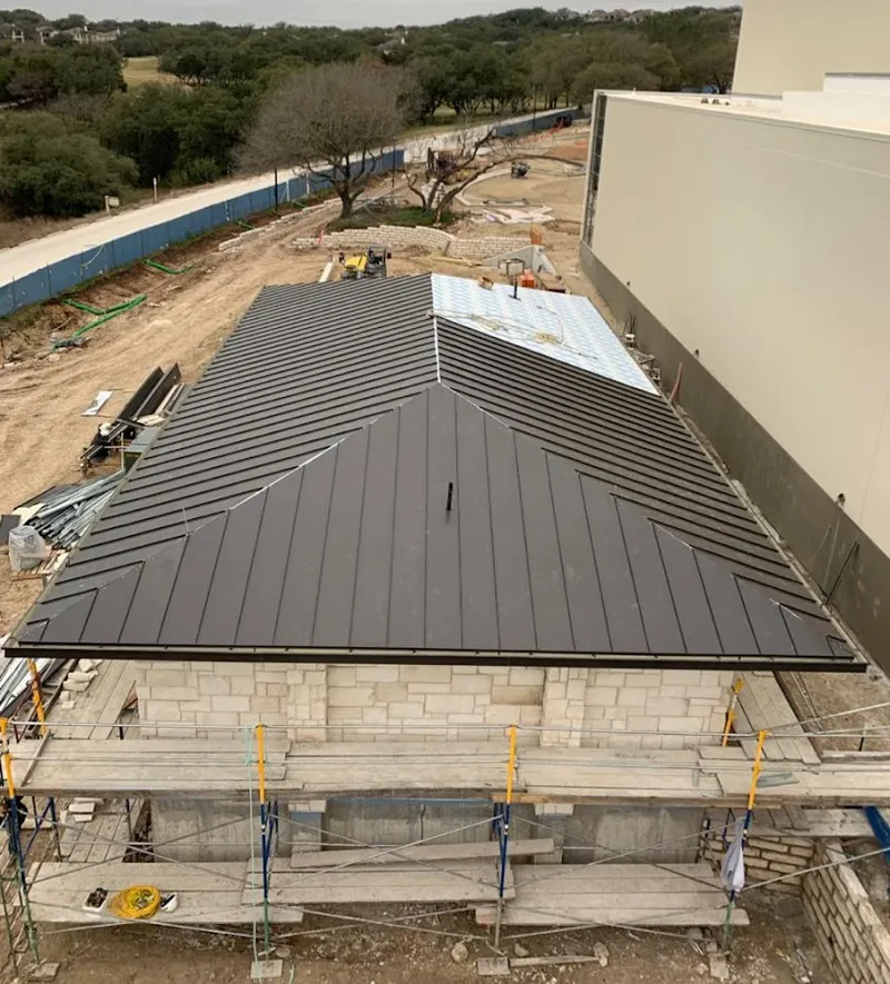 Metal roof new construction with scaffolding in Blanchard