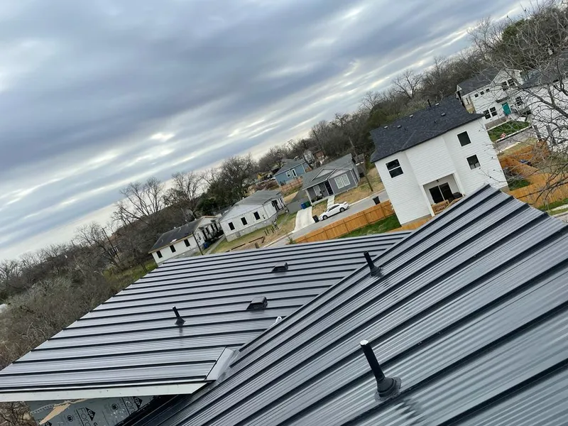 Standing seam metal roof panels with vents for Skylight Repair in Blanchard